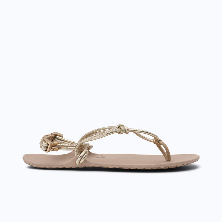 Xero Shoes Genesis Leather Women Sandal in Beige with Gold Strap and with Toe Facing Right